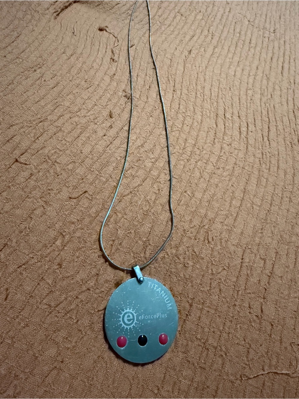 eForcePlus Titanium Round Pendant Necklace in Silver with Pink Accents